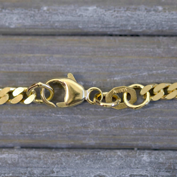 Goldkette als Panzerkette flach in Gelbgold 375 / 9K, 60 cm lang, 2,7 mm breit, Gewicht ca. 10 g.