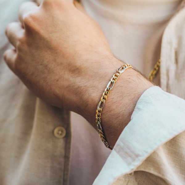 Armband als Figarokette hohl Bicolor in Gelbgold / Weißgold 585 / 14K, 19 cm lang, 5,7 mm breit, Gewicht ca. 5.1 g.