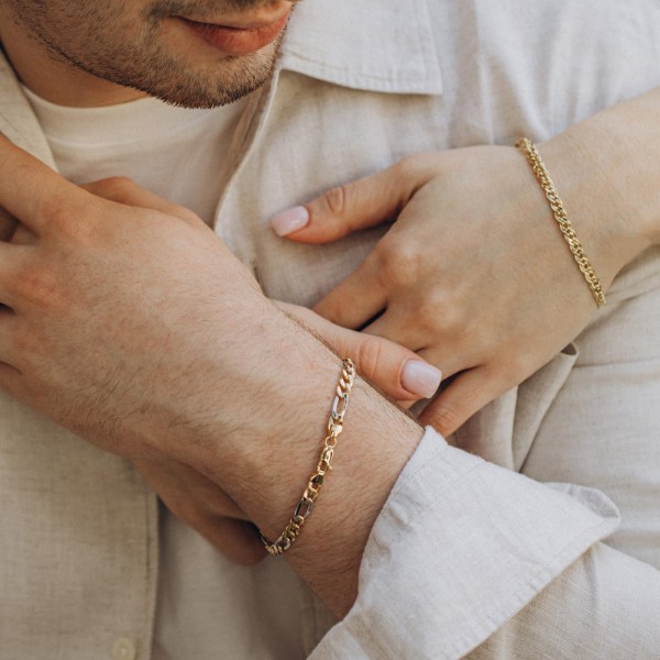 Armband als Figarokette hohl Bicolor in Gelbgold / Weißgold 750 / 18K, 21 cm lang, 5,7 mm breit, Gewicht ca. 6.7 g.