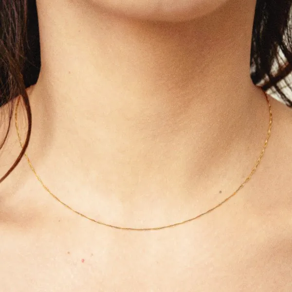 Goldkette als Singapurkette in Gelbgold 375 / 9K, 55 cm lang, 1 mm breit, Gewicht ca. 0.9 g.