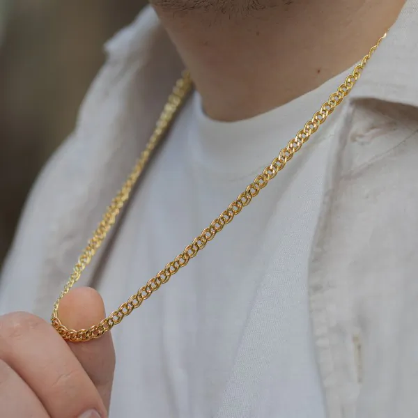 Goldkette als Zwillingspanzerkette in Gelbgold 375 / 9 Karat, 42 cm lang, 4.8 mm breit, Gewicht ca. 6.3 g.