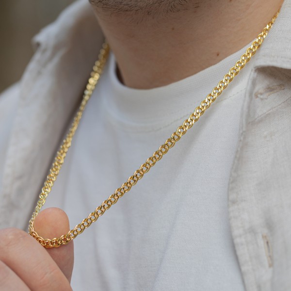 Goldkette als Zwillingspanzerkette in Gelbgold 375 / 9 Karat, 65 cm lang, 4.8 mm breit, Gewicht ca. 9.5 g.