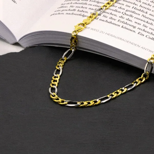 Goldkette als Figarokette hohl in Bicolor Gelbgold / Weißgold 585 / 14K, 55 cm lang, 5,7 mm breit, Gewicht ca. 13.4 g.