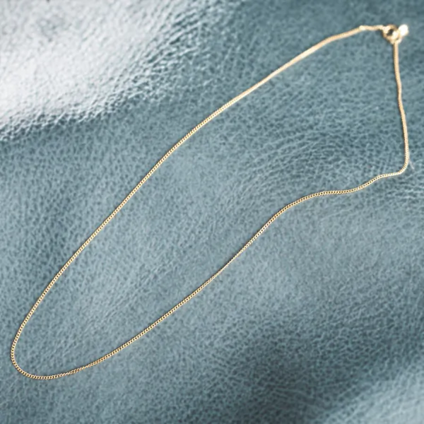 Goldkette als Panzerkette flach in Gelbgold 585 / 14 Karat, 60 cm lang, 1.1 mm breit, Gewicht ca. 2,3 g.