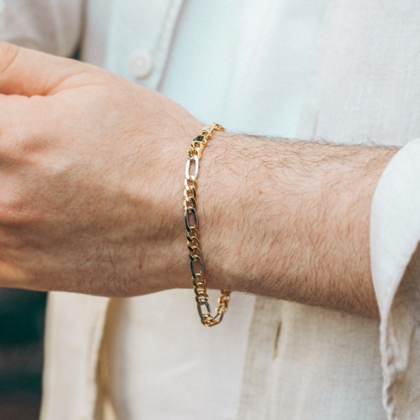 Armband als Figarokette hohl Bicolor in Gelbgold / Weißgold 585 / 14K, 21 cm lang, 5,7 mm breit, Gewicht ca. 5.6 g.