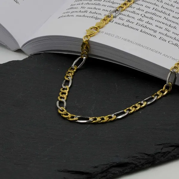 Goldkette als Figarokette hohl in Bicolor Gelbgold / Weißgold 750 / 18K, 70 cm lang, 5,7 mm breit, Gewicht ca. 20.5 g.