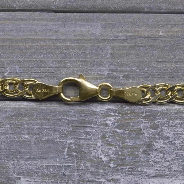 Armband als Zwillingspanzerkette in Gelbgold 333 / 8K, 21 cm lang, 3,9 mm breit, Gewicht ca. 2 g.