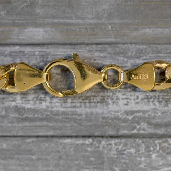 Goldkette als Figarokette hohl Bicolor in Gelbgold / Weißgold 333 / 8K, 50 cm lang, 5,7 mm breit, Gewicht ca. 9.1 g.