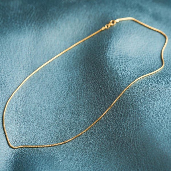 Goldkette als Schlangenkette in Gelbgold 585 / 14K, 70 cm lang, 1,4 mm breit, Gewicht ca. 6.4 g.