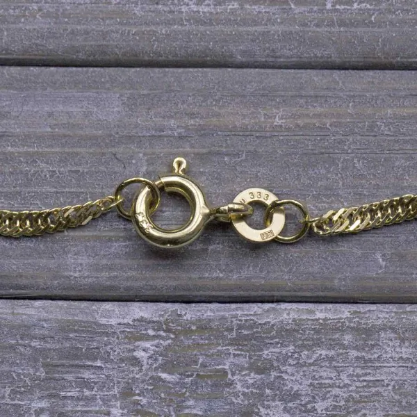 Armband als Singapurkette in Bicolor Gelbgold / Weißgold 333 / 8K, 21 cm lang, 1,8 mm breit, Gewicht ca. 1.2 g.