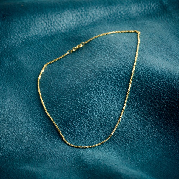 Goldkette als Ankerkette stirnseitig diamantiert in Gelbgold 585 / 14K, 50 cm lang, 1,3 mm breit, Gewicht ca. 4.5 g.