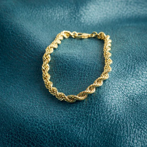 Armband als Kordelkette hohl in Gelbgold 585 / 14K, 21 cm lang, 5 mm breit, Gewicht ca. 7.6 g.