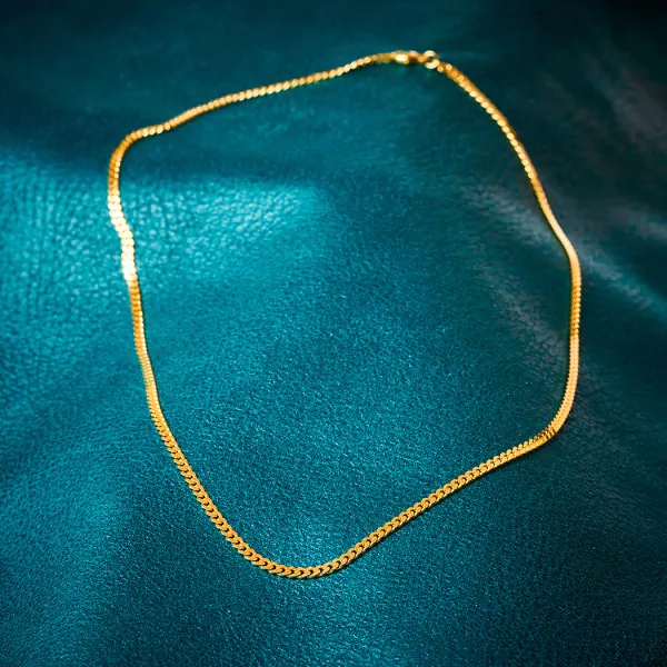 Goldkette als Panzerkette flach in Gelbgold 585 / 14K, 100 cm lang, 2,7 mm breit, Gewicht ca. 19.3 g.