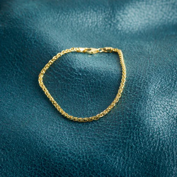 Armband als Zopfkette in Gelbgold 333 / 8 K, 22 cm lang, 2,5mm breit, Gewicht ca. 4.8 g.