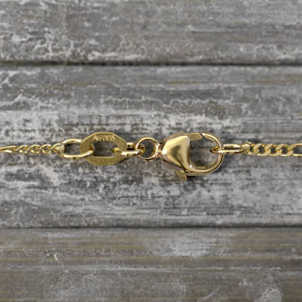 Goldkette als Figarokette diamantiert in Gelbgold 375 / 9 Karat, 55 cm lang, 1.5 mm breit, Gewicht ca. 2,8 g.