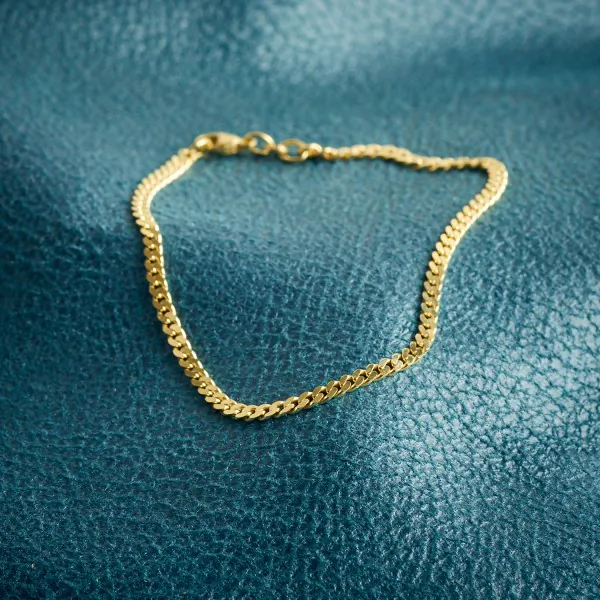 Armband als Panzerkette flach in Gelbgold 375 / 9K, 18 cm lang, 2.7 mm breit, Gewicht ca. 3.2 g.
