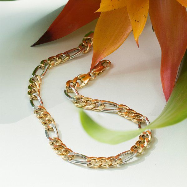 Armband als Figarokette hohl Bicolor in Gelbgold / Weißgold 585 / 14K, 19 cm lang, 5,7 mm breit, Gewicht ca. 5.1 g.