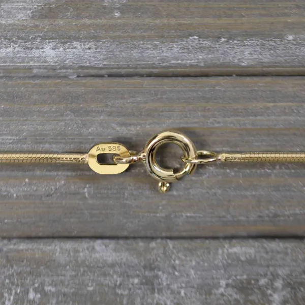 Goldkette als Schlangenkette in Gelbgold 585 / 14 Karat, 65 cm lang, 1.1 mm breit, Gewicht ca. 6,9 g.