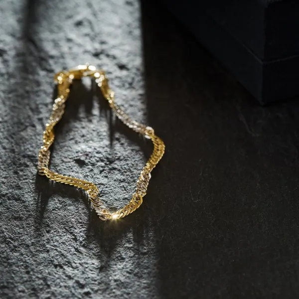 Armband als Singapurkette in Gelbgold 585 / 14 Karat, 22.5 cm lang, 2.9 mm breit, Gewicht ca. 3.4 g.