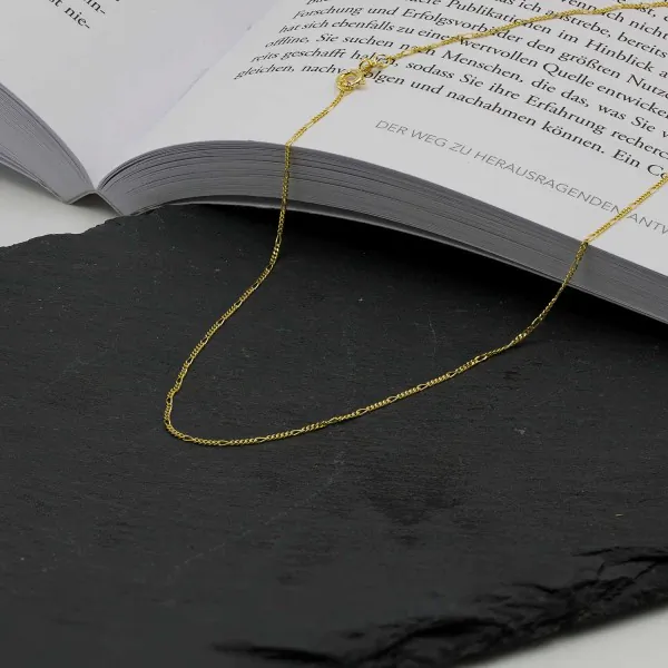 Goldkette als Figarokette diamantiert in Gelbgold 585 / 14K, 45 cm lang, 1,1 mm breit, Gewicht ca. 1.5 g.