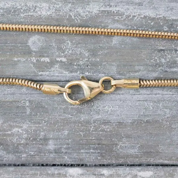 Goldkette als Schlangenkette in Gelbgold 750 / 18K, 45 cm lang, 1,4 mm breit, Gewicht ca. 4.8 g.