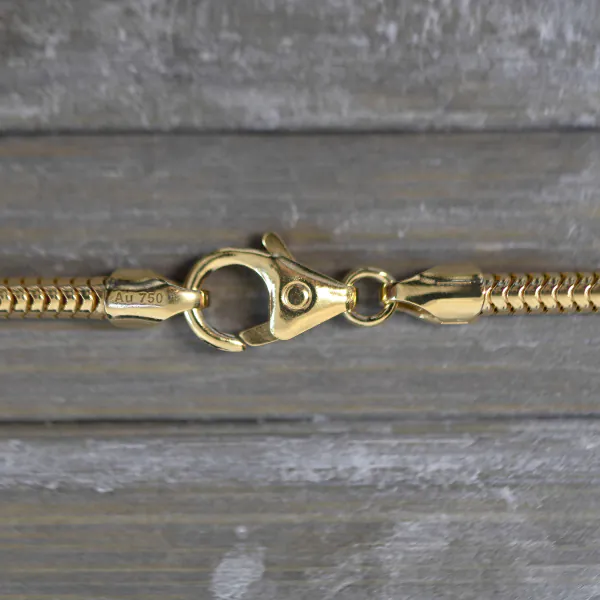 Goldkette als Schlangenkette in Gelbgold 750 / 18 Karat, 65 cm lang, 2.4 mm breit, Gewicht ca. 24 g.