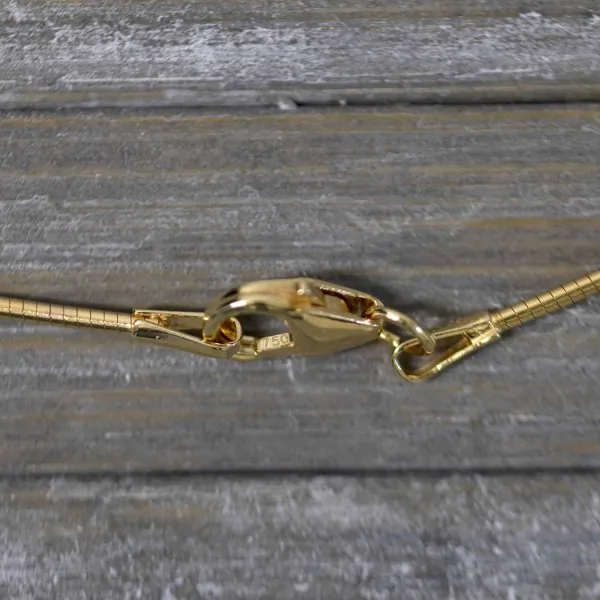 Goldkette als Tondakette in Gelbgold 750 / 18K, 45 cm lang, 1 mm breit, Gewicht ca. 5.5 g.