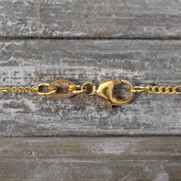 Goldkette als Figarokette diamantiert in Gelbgold 750 / 18 Karat, 65 cm lang, 1.5 mm breit, Gewicht ca. 3.7 g.