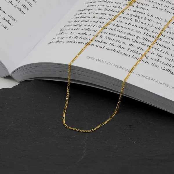 Goldkette als Figarokette diamantiert in Gelbgold 750 / 18 Karat, 65 cm lang, 1.5 mm breit, Gewicht ca. 3.7 g.