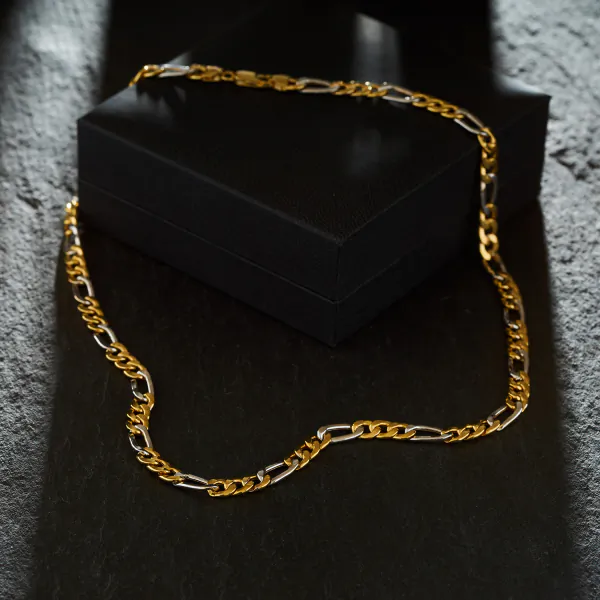 Goldkette als Figarokette hohl in Bicolor Gelbgold / Weißgold 585 / 14K, 55 cm lang, 5,7 mm breit, Gewicht ca. 13.4 g.