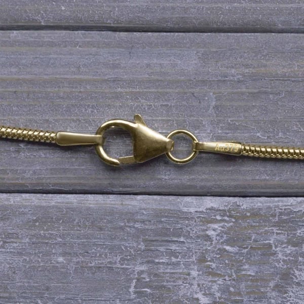 Goldkette als Schlangenkette in Gelbgold 375 / 9 Karat, 65 cm lang, 1.2 mm breit, Gewicht ca. 5.2 g.