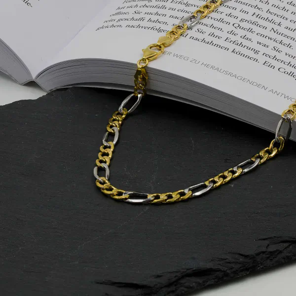 Goldkette als Figarokette hohl Bicolor in Gelbgold / Weißgold 333 / 8K, 50 cm lang, 5,7 mm breit, Gewicht ca. 9.1 g.