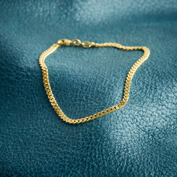 Armband als Panzerkette flach in Gelbgold 375 / 9K, 20 cm lang, 2.7 mm breit, Gewicht ca. 3.6 g.