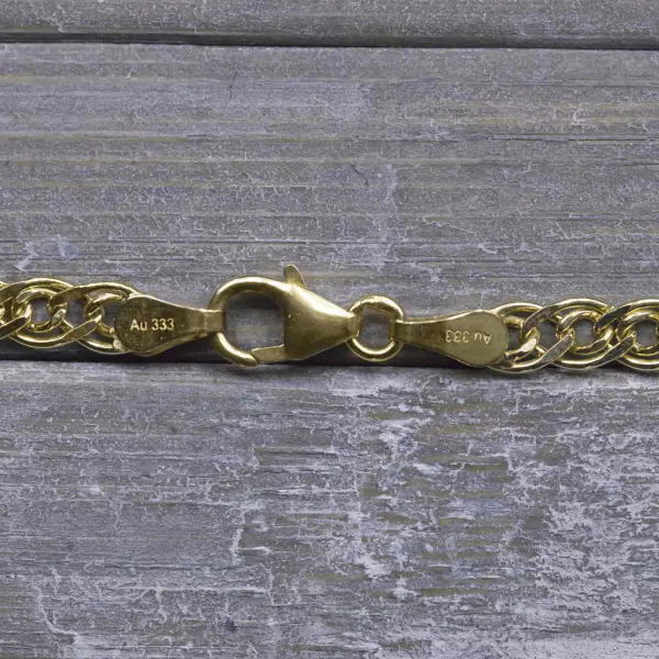 Armband als Zwillingspanzerkette in Gelbgold 333 / 8K, 21 cm lang, 3,9 mm breit, Gewicht ca. 2 g.