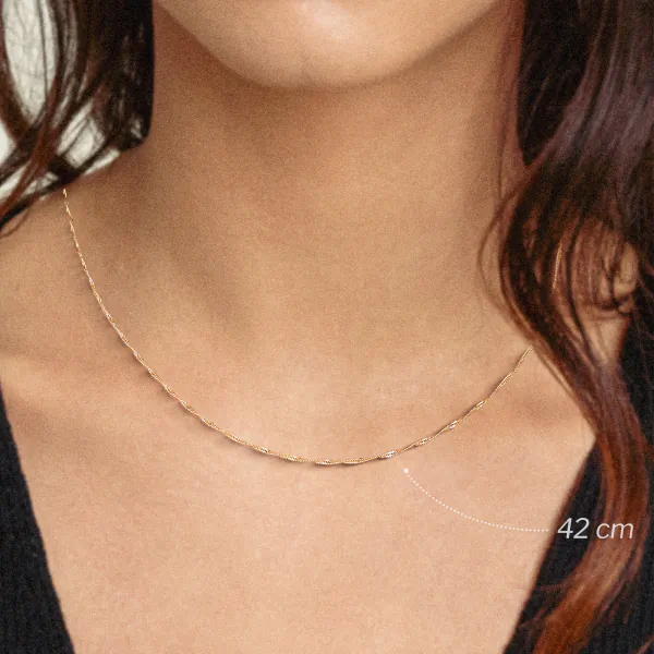 Goldkette als Singapurkette in Gelbgold 375 / 9 Karat, 75 cm lang, 1.2 mm breit, Gewicht ca. 2.1 g.