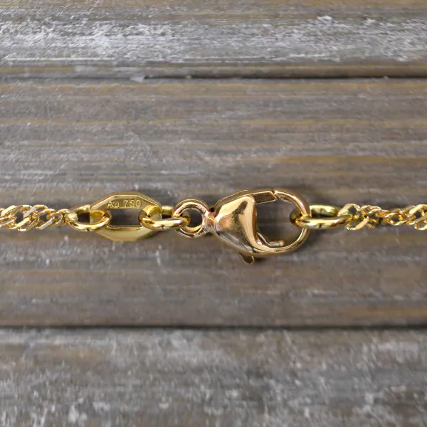 Goldkette als Singapurkette in Gelbgold 750 / 18K, 45 cm lang, 1.8 mm breit, Gewicht ca. 3.5 g.