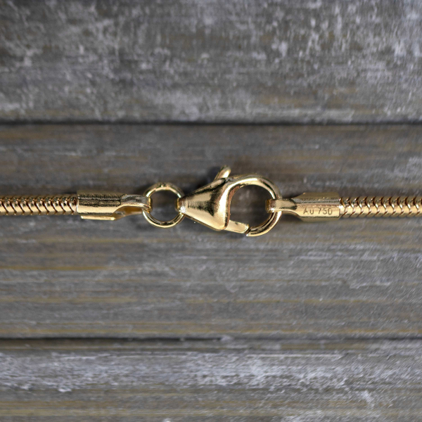 Goldkette als Schlangenkette in Gelbgold 750 / 18 Karat, 65 cm lang, 1.6 mm breit, Gewicht ca. 9,8 g.