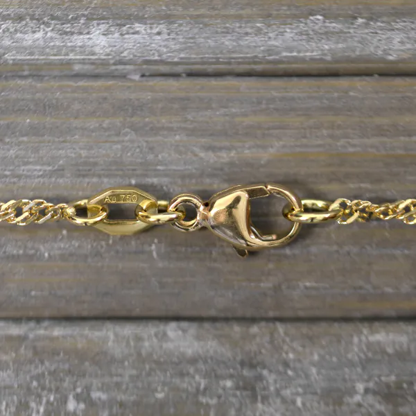 Armband als Singapurkette in Gelbgold 750 / 18 Karat, 19.5 cm lang, 2.4 mm breit, Gewicht ca. 2.2 g.