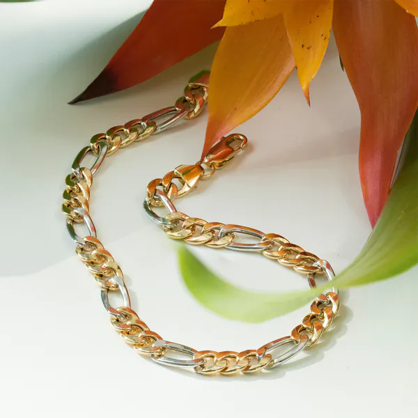 Armband als Figarokette hohl Bicolor in Gelbgold / Weißgold 333 / 8K, 19 cm lang, 5,7 mm breit, Gewicht ca. 4.06 g.