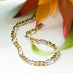 Armband als Figarokette hohl Bicolor in Gelbgold / Weißgold 750 / 18K, 19 cm lang, 5,7 mm breit, Gewicht ca. 6.1 g.