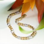 Armband als Figarokette hohl Bicolor in Gelbgold / Weißgold 585 / 14K, 19 cm lang, 5,7 mm breit, Gewicht ca. 5.1 g.