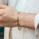 Armband als Figarokette hohl Bicolor in Gelbgold / Weißgold 333 / 8K, 21 cm lang, 5,7 mm breit, Gewicht ca. 4.1 g.