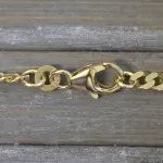 Armband als Panzerkette flach in Gelbgold 333 / 8K, 23 cm lang, 3,4 mm breit, Gewicht ca. 5.7 g.