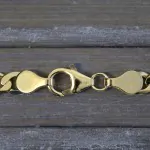 Armband als Panzerkette facettiert in Gelbgold 333 / 8 K, 18 cm lang, 5mm breit, Gewicht ca. 4.7 g.