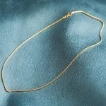 Goldkette als Schlangenkette in Gelbgold 585 / 14K, 55 cm lang, 1,4 mm breit, Gewicht ca. 5.3 g.