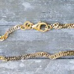 Armband als Singapurkette Bicolor in Gelbgold / Weißgold 333 / 8K, 19 cm lang, 2,4 mm breit, Gewicht ca. 1.7 g.