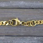 Armband als Panzerkette flach in Gelbgold 375 / 9K, 20 cm lang, 2.7 mm breit, Gewicht ca. 3.6 g.
