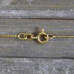 Goldkette als Panzerkette flach in Gelbgold 375 / 9 Karat, 65 cm lang, 1.1 mm breit, Gewicht ca. 2,3 g.