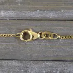 Goldkette als Panzerkette flach in Gelbgold 375 / 9K, 70 cm lang, 1,4 mm breit, Gewicht ca. 3.9 g.