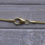 Goldkette als Schlangenkette in Gelbgold 375 / 9 Karat, 95 cm lang, 1.2 mm breit, Gewicht ca. 7 g.